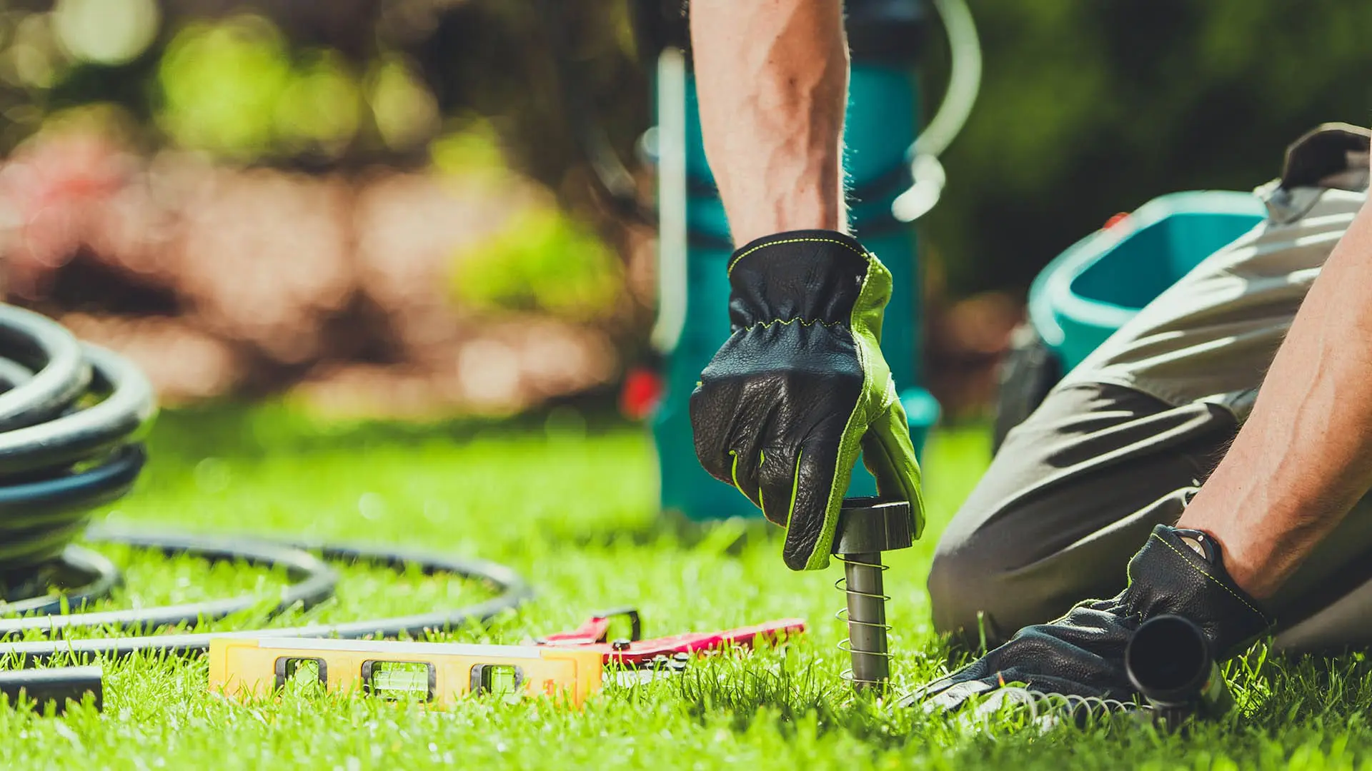 A,Gardener,Is,Focused,On,Installing,An,Irrigation,System,In